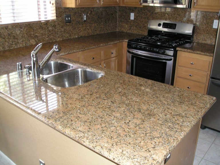 Granite kitchen countertops with a full backsplash