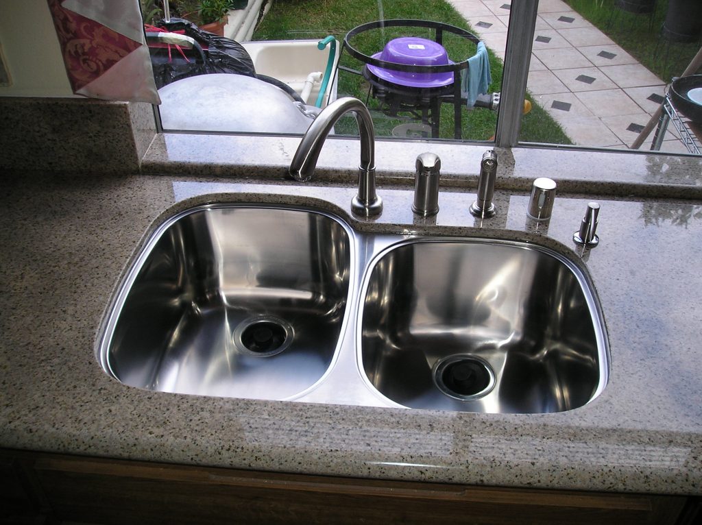 Granite countertops ontario with a full backsplash