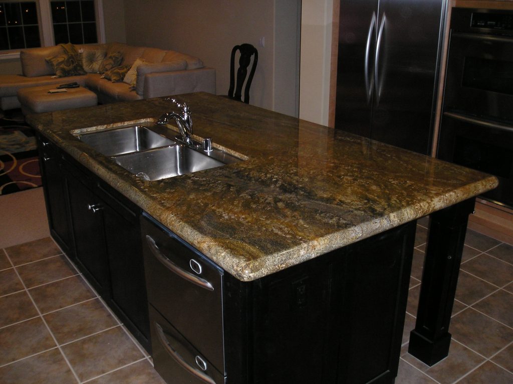 Granite countertops riverside with a full backsplash