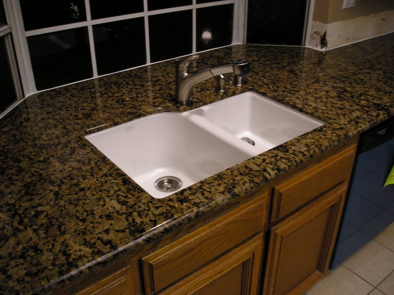Granite kitchen countertops with a white undermount sink