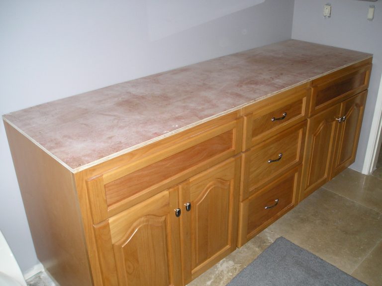 Countertop on cabinets ready for a laundry or utility room