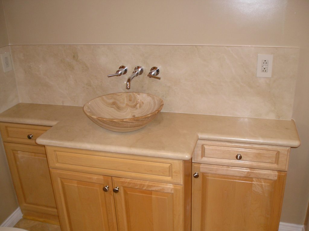 Marble style bathroom vanity with a vessel sink