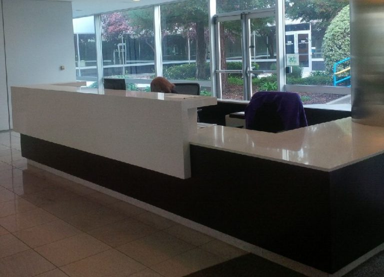 Example of a commercial reception desk with a stone top